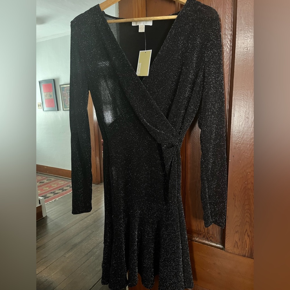 A Michael Kors black with silver sparkles long sleeve dress.